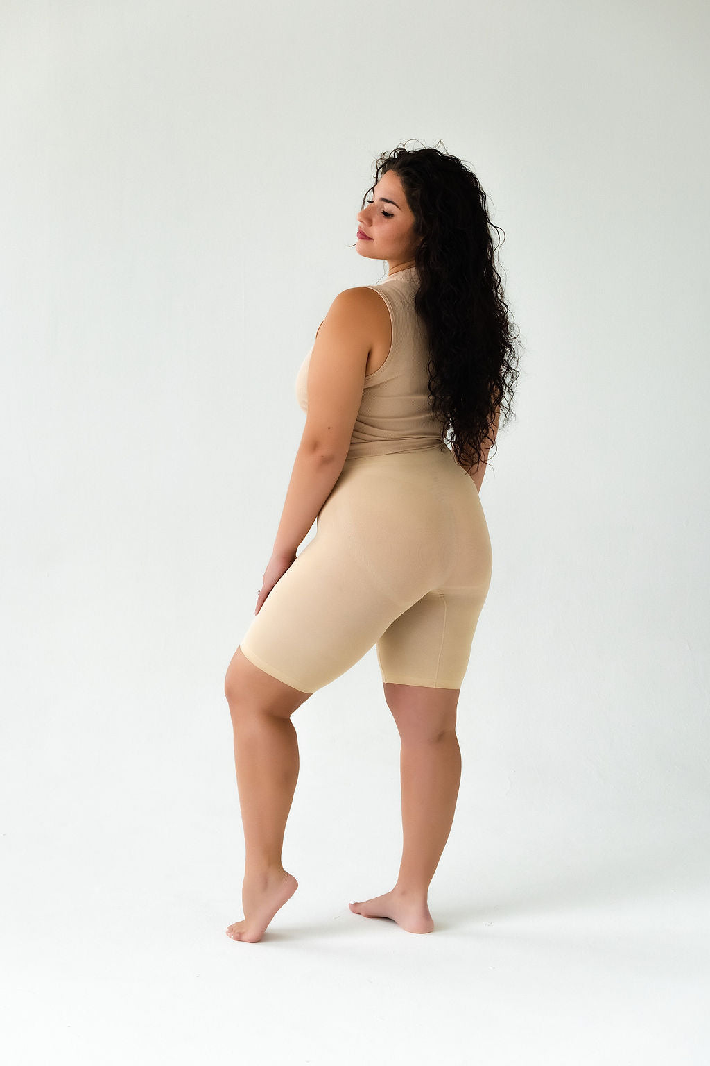 Model looking over her shoulder in Classic Cooling in beige, back view